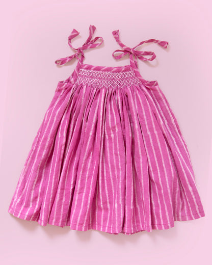 Hand-smocked Jaipur cotton baby dress in taffy pink stripe with tie-up shoulders for newborn girls by MyBud